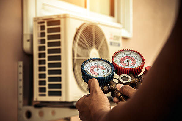 Professional Air Conditioning Service technician working in Monmouth Junction, NJ